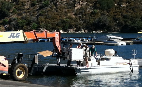   Loading of pallets of PAK 27 onto an application pontoon.  